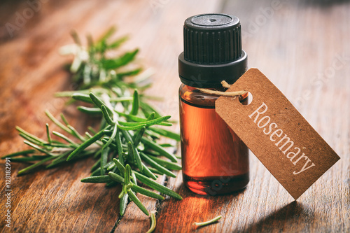 Photography Fresh rosemary on wooden background