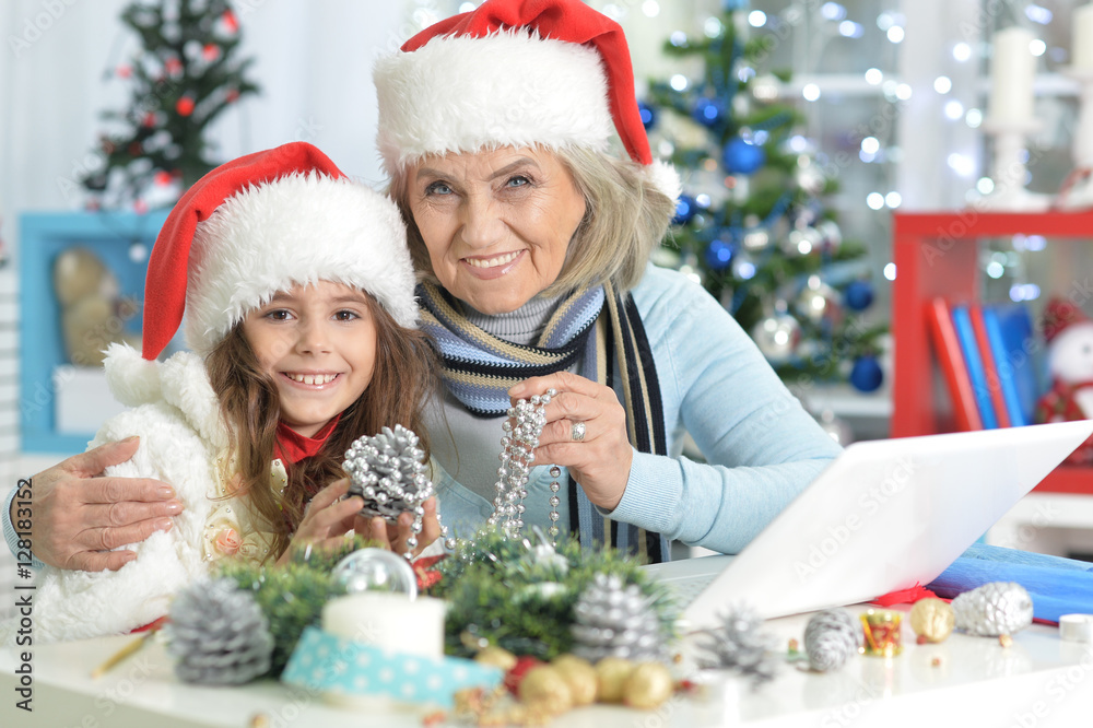 Grandmother and child preparing for Christmas Grandmother and child preparing for Christmas