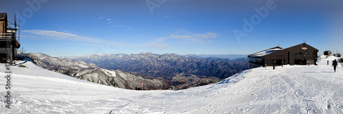 Hakuba town nestled between the snow covered mountain ranges.  Viewing from the range that includes many ski resorts, including Happo-One and Goryu.