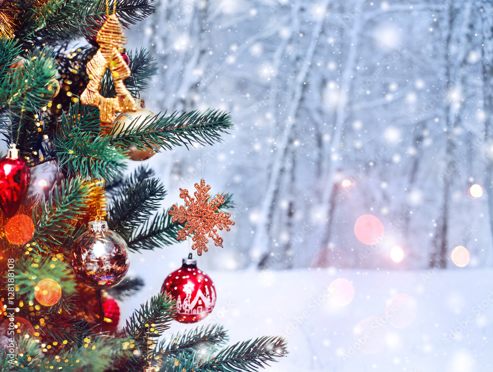 Christmas tree background and Christmas decorations with snow, blurred, sparking, glowing. Happy New Year and Xmas theme