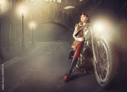 Fototapeta Naklejka Na Ścianę i Meble -  redhead girl on a motorcycle