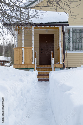 Snow track to the cottage door © serg269