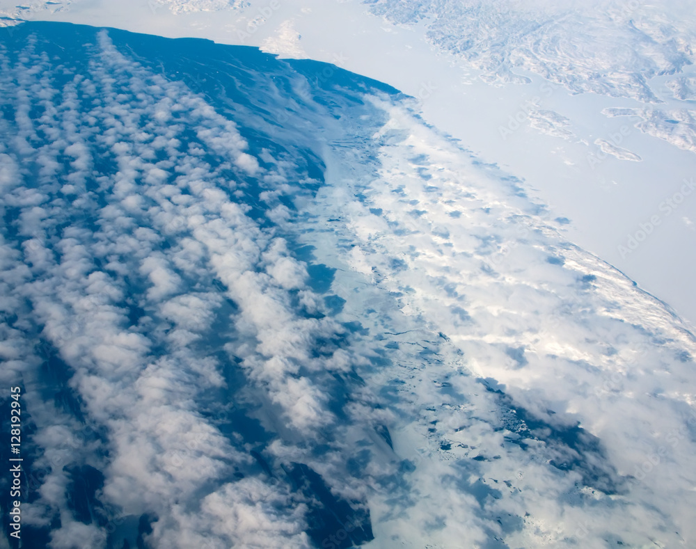 Fototapeta premium Aerial view of the Greenland cloudy coastline