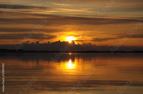 Sun goes down to the clouds