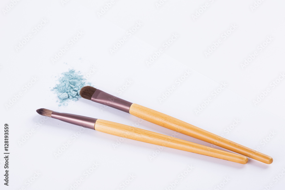 loose eyeshadow and makeup brushes isolated loose eyeshadow and makeup brushes isolated