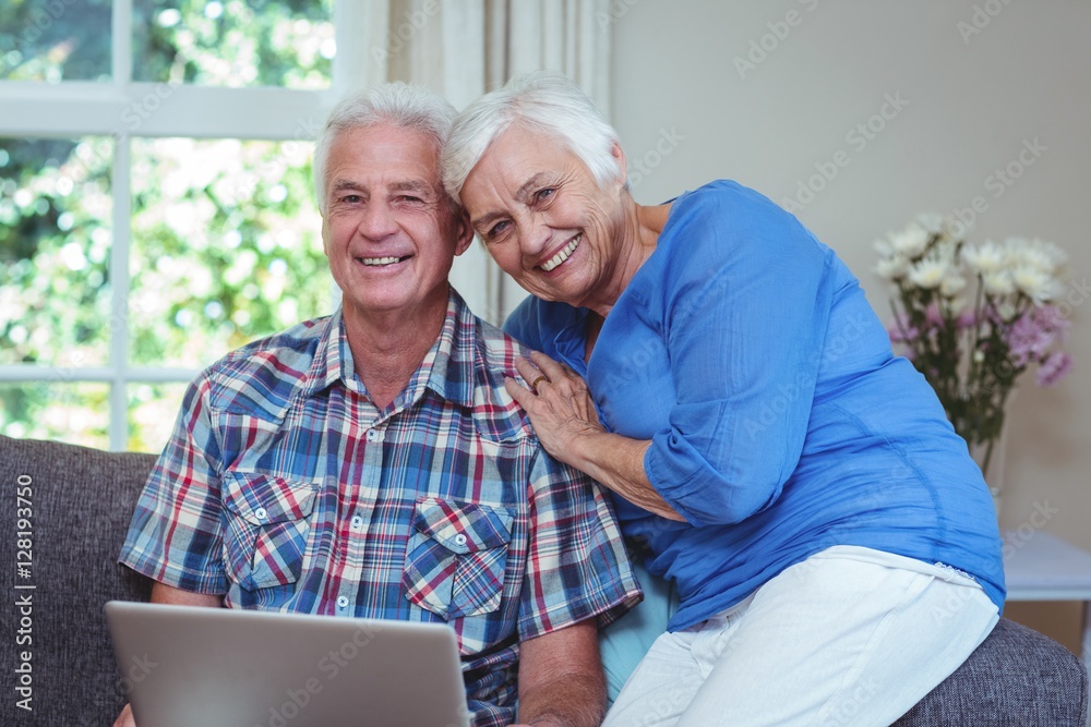 Portrait of happy senior couple using laptop Portrait of happy senior couple using laptop