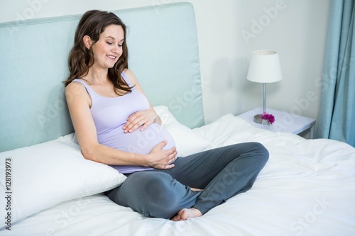 Free Download Pregnant woman touching her belly - GFXLoad