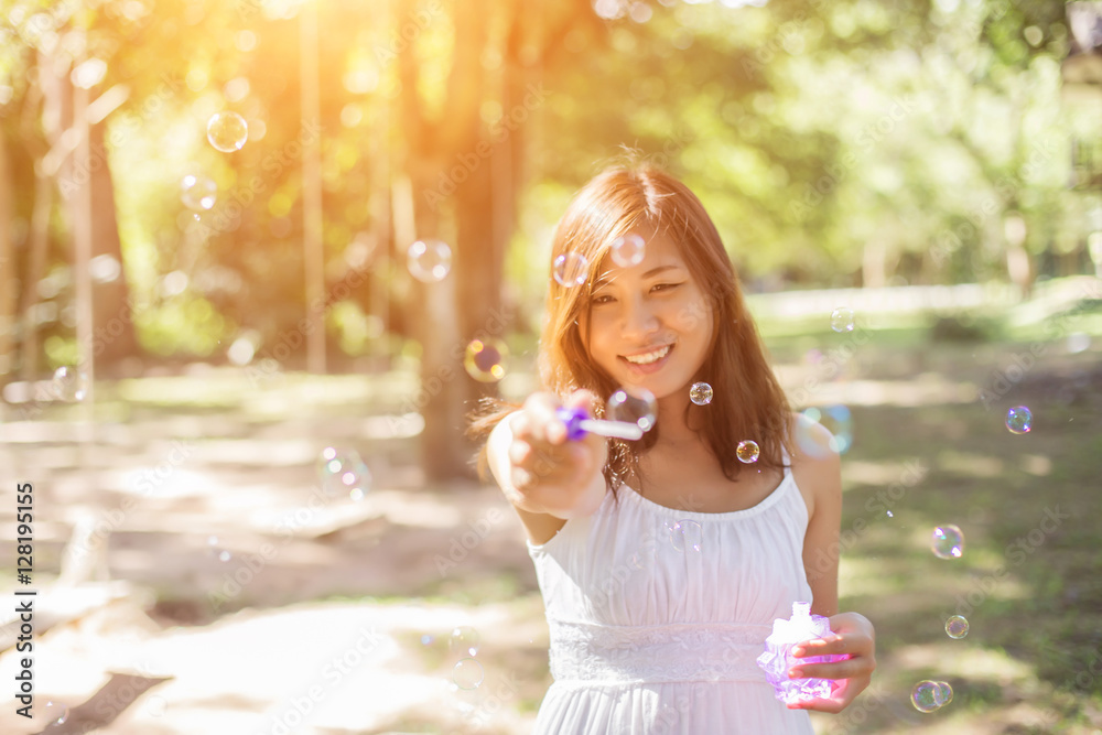 a beautiful woman blowing bubbles a beautiful woman blowing bubbles