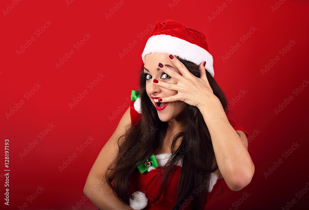 Fun surprising makeup woman covering face the manicured hand wit Fun surprising makeup woman covering face the manicured hand wit
