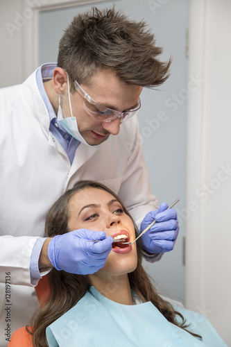 Female patient open her mouth during treatment