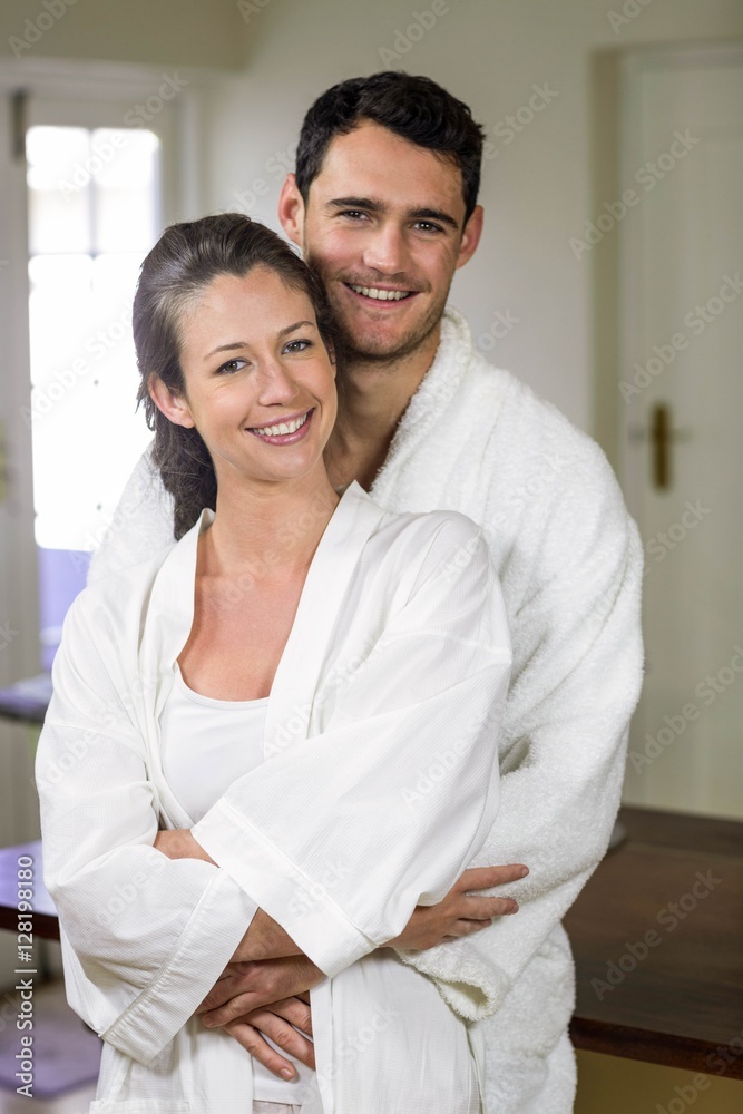 Couple in bathrobe embracing each other Couple in bathrobe embracing each other