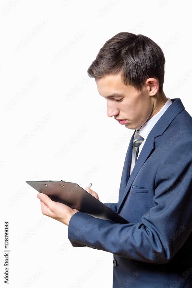 young man businessman holding clipboard and read in the office young man businessman holding clipboard and read in the office