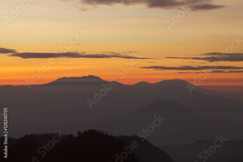 the warm tones of the rising sun in the tengger national park.