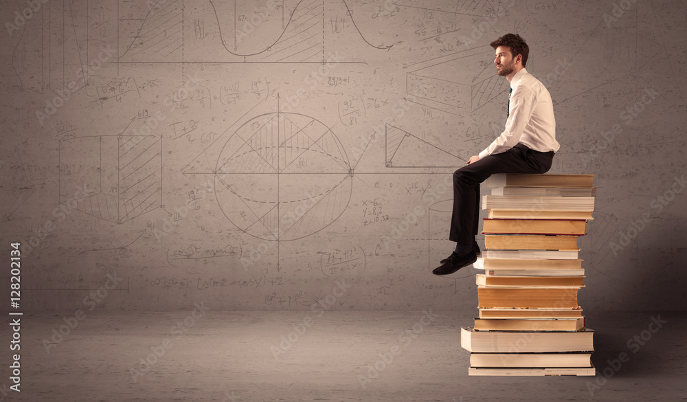Businessman sitting on books Businessman sitting on books