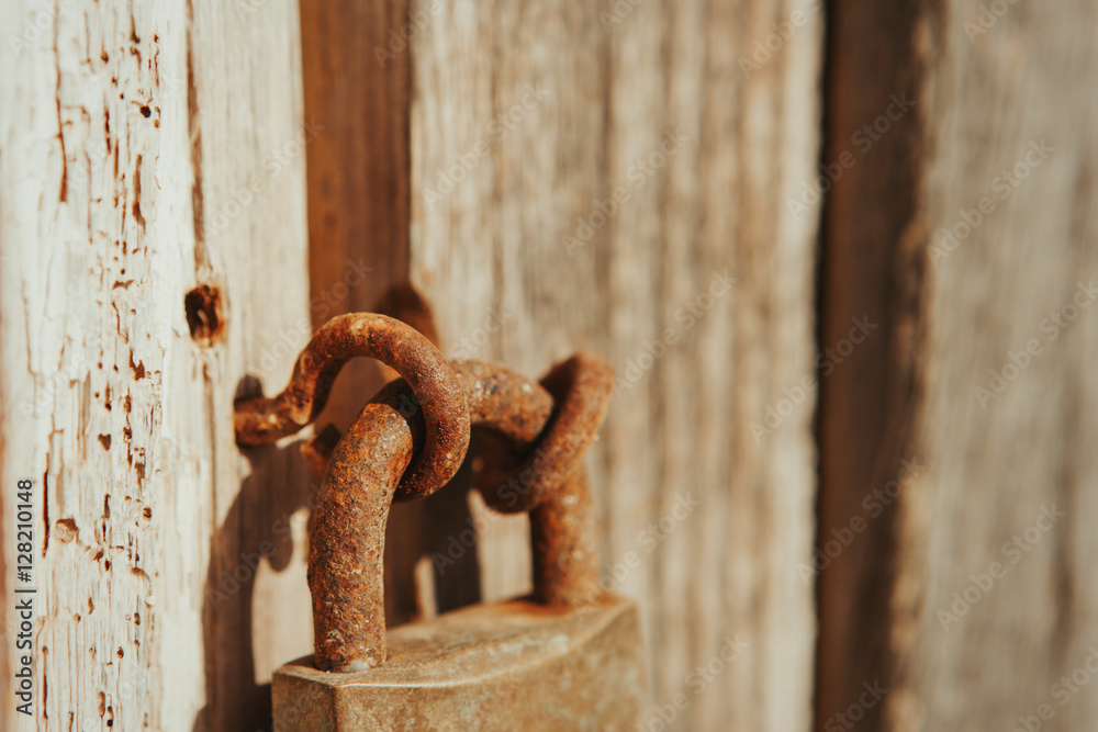 Closed rusty on an wooden door