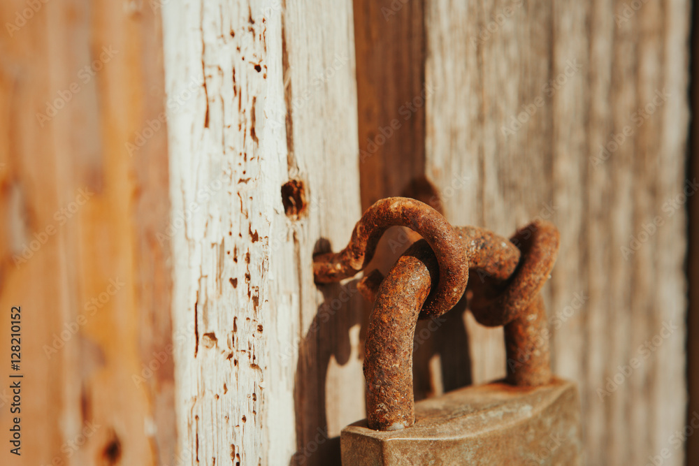 Closed rusty on an wooden door
