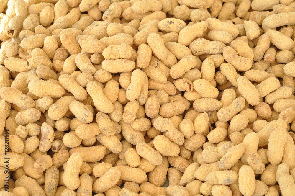 Raw peanuts at a farmer's market, texture background top view Raw peanuts at a farmer's market, texture background top view