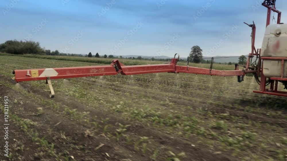 Close-up tracking shot of spraying crops.
Close-up tracking shot of spraying crops.
