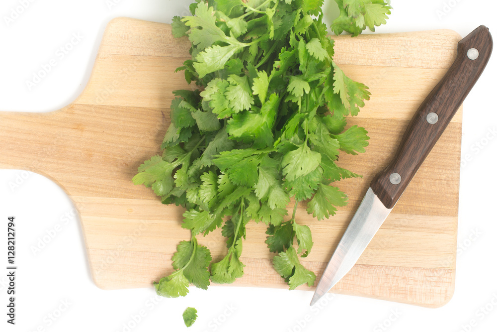 Fresh Coriander over a wooden board Fresh Coriander over a wooden board