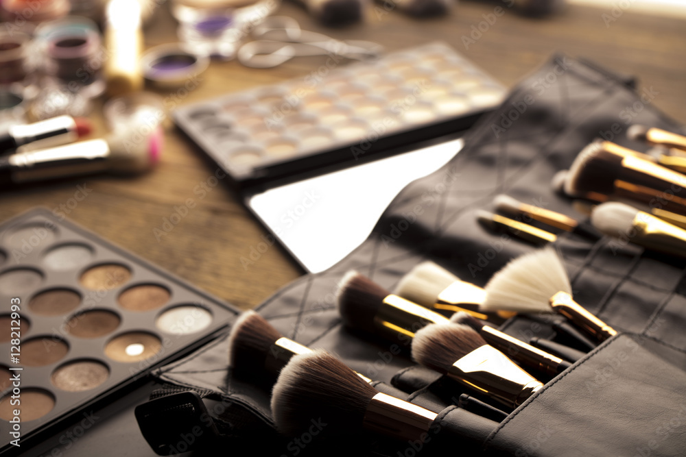 Make up artist theme. Various makeup products. Top view. Set of professional cosmetic: make-up brushes, shadows, lipstick. Place for typography and logo. Make up artist theme. Various makeup products. Top view. Set of professional cosmetic: make-up brushes, shadows, lipstick. Place for typography and logo.