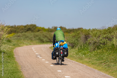 Cyclist on a bike path in the dunes Noordwijk photo
