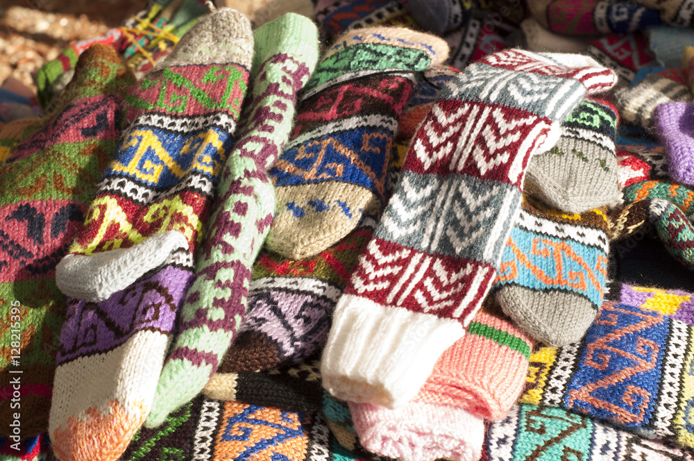Group of handmade colorful knitted socks in the market