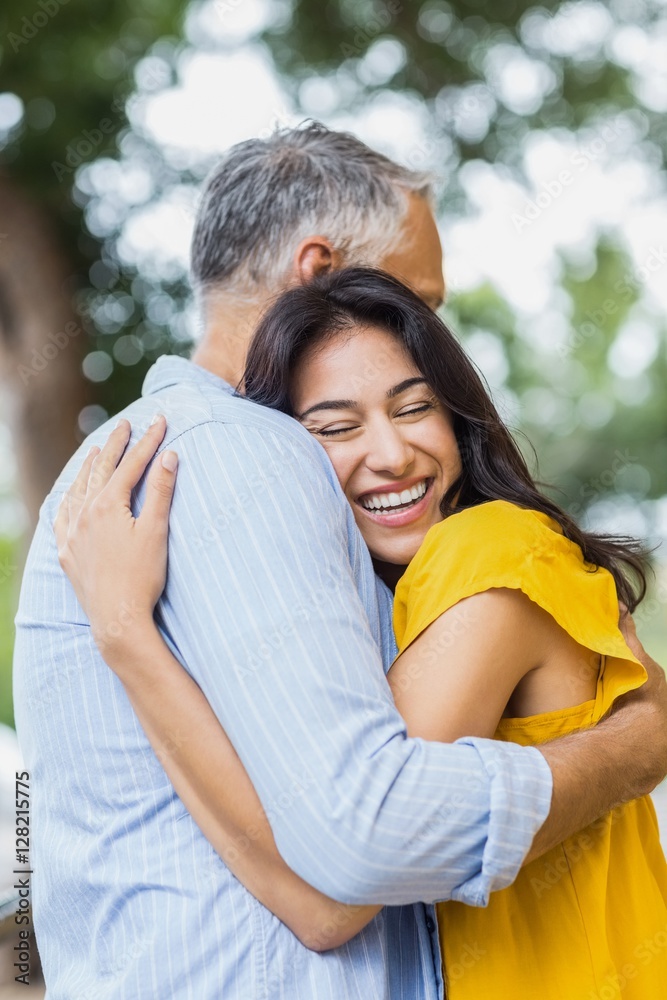 Fototapeta premium Happy woman hugging man