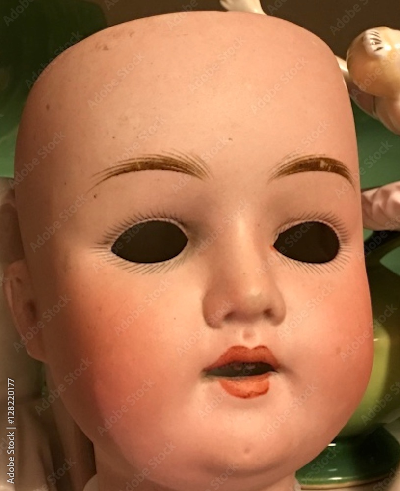 Vintage porcelain doll face with missing eyes hand painted