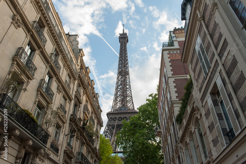 The Eiffel Tower seen behind buildings in Paris  France