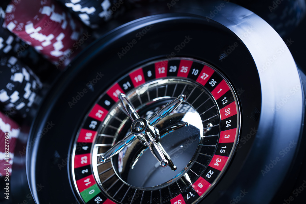 Casino theme. High contrast image of casino roulette, poker game, dice game, poker chips on a gaming table, all on colorful bokeh background. Place for typography and logo.
Casino theme. High contrast image of casino roulette, poker game, dice game, poker chips on a gaming table, all on colorful bokeh background. Place for typography and logo.