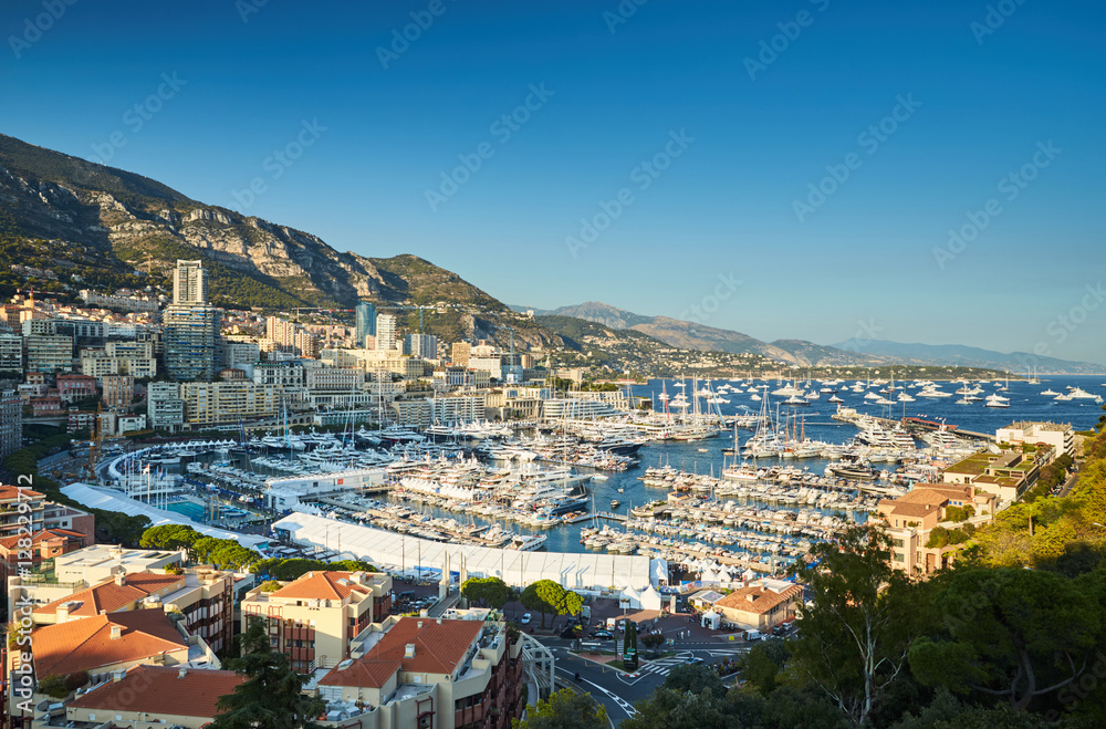 World Fair MYS Monaco Yacht Show, Port Hercules, luxury megayachts, many shuttles, taxi boat, presentations, Journalists, boat traffic, Azur water, aerial view, cityscape, mountains on background