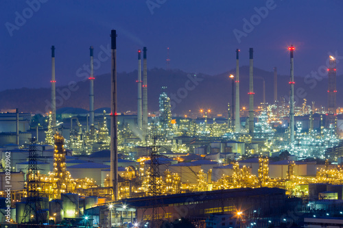 Night light over Oil refinery aerial view with twilight sky background © pranodhm