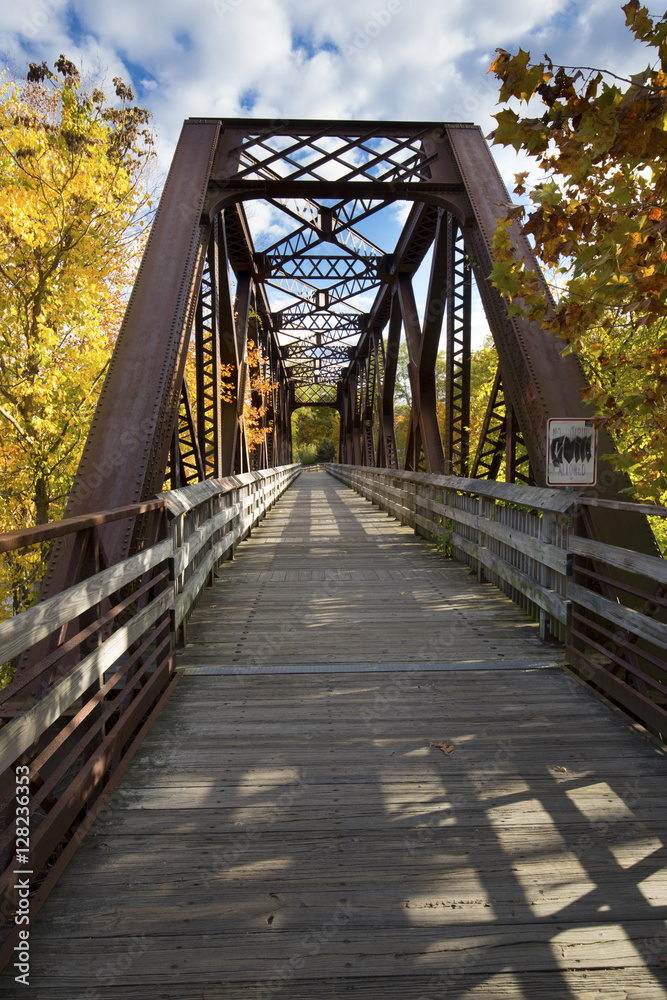 Iron bridge of a former railroad line now carries the Farmington River Trail in Canton, Connec