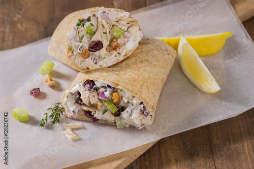 Chicken Wrap Cut in Half on Cutting Board with Wax Paper