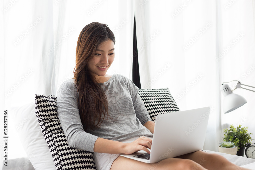 Young asian lady using computer Young asian lady using computer