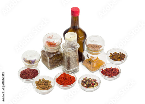 Various spices and sauce in different small glassware