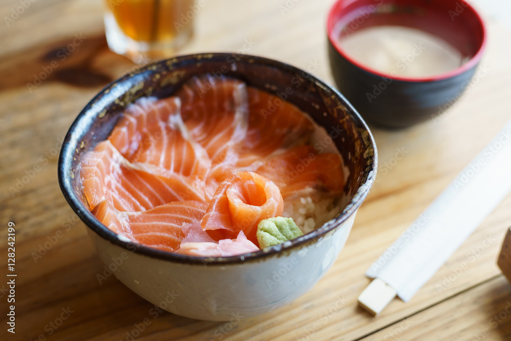 Salmon Donburi serve with miso soup on wooden table Salmon Donburi serve with miso soup on wooden table