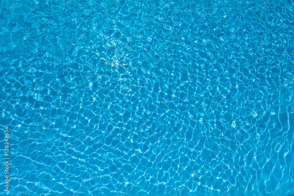 Obraz premium Beautiful ripple water surface with sun reflection in swimming p