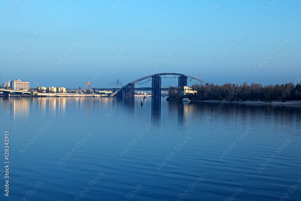 Morning view to the unfinished bridge. City landscape. Trukhanov island