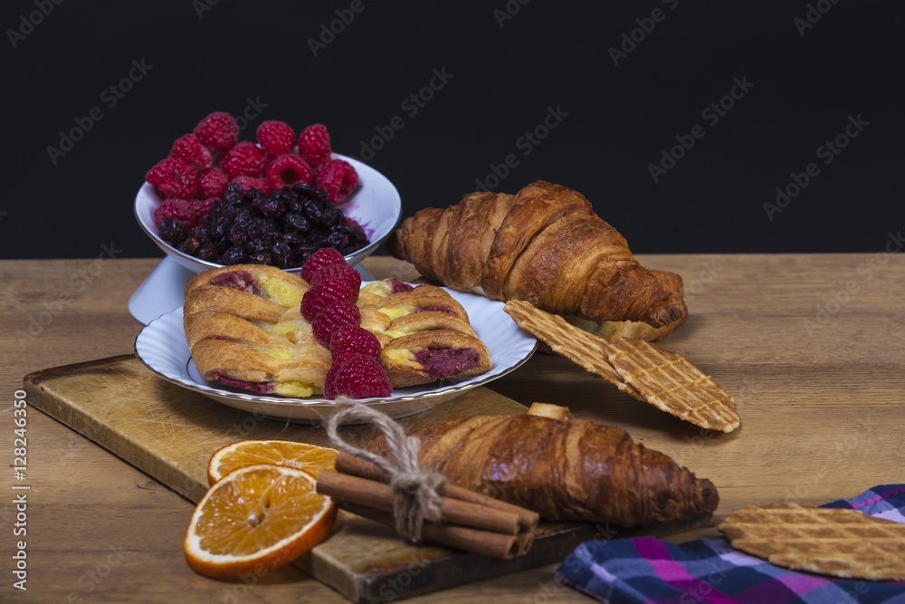 assortment of pastries with honey, raspberries and other - vintage