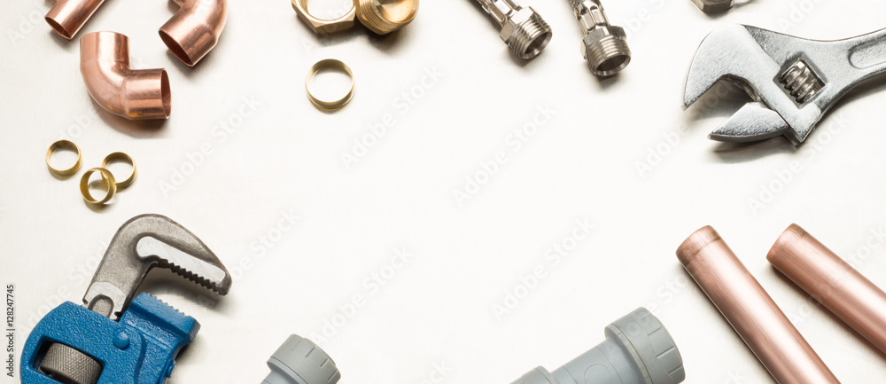 Plumbers Tools and Plumbing Materials Banner with Copy Space
