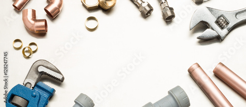 Fotografija Plumbers Tools and Plumbing Materials Banner with Copy Space