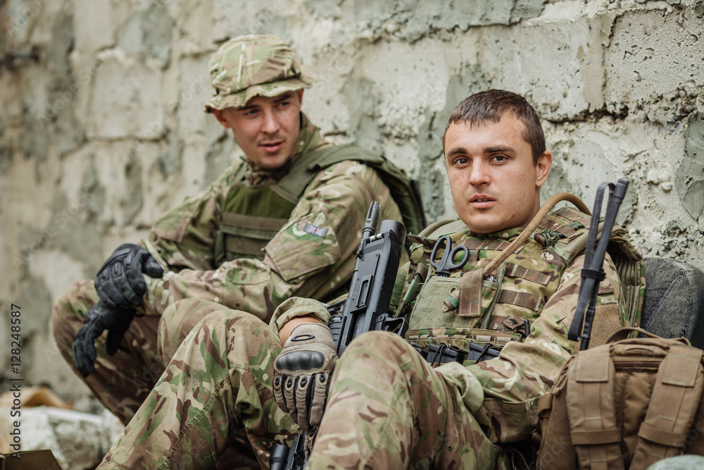 Portrait soldier or private military contractor holding sniper ranger Portrait soldier or private military contractor holding sniper ranger