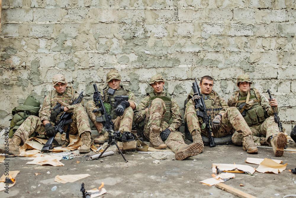 Fototapeta premium british rangers sitting and looking at the camera