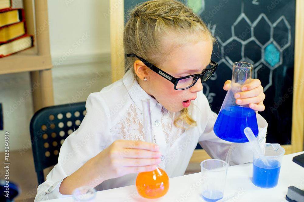 young girl making science experiments young girl making science experiments