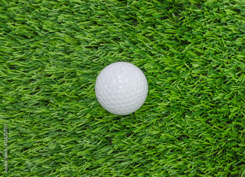 Golf ball on green grass.