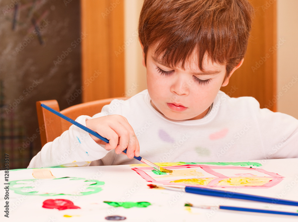 Little boy painting
