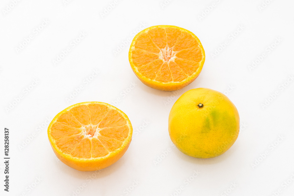 whole and half cut orange on white background whole and half cut orange on white background
