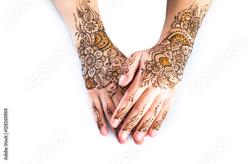 mehendi on the hands on a white background