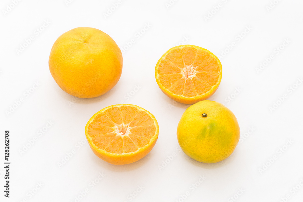 whole and half cut orange on white background whole and half cut orange on white background